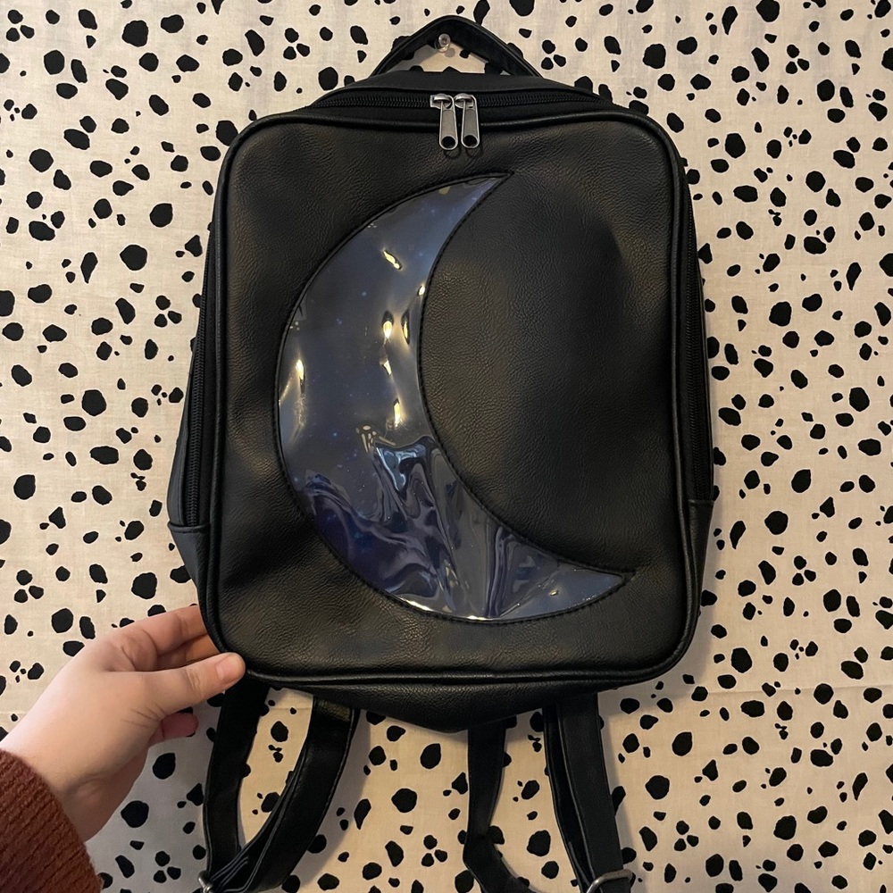 black crescent moon backpack
